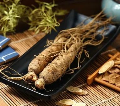 Pale ginseng roots laid out on a wooden tray